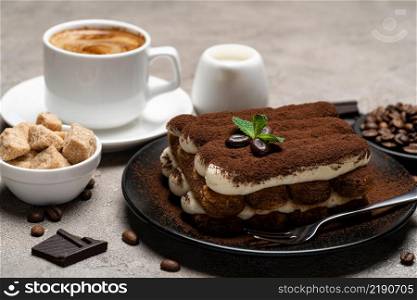 Classic tiramisu dessert, cup of coffee, sugar and milk on concrete background or table. Classic tiramisu dessert, cup of coffee, sugar and milk on concrete background