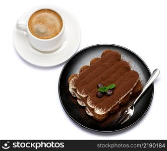 Classic tiramisu dessert on ceramic plate and cup of coffee isolated on white background with clipping path embedded. Classic tiramisu dessert on ceramic plate and cup of coffee isolated on white background with clipping path