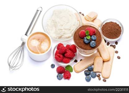 Classic tiramisu dessert with blueberries and raspberries in a glass, savoiardi and mascarpone cheese isolated on a white background with clipping path. Classic tiramisu dessert with blueberries and raspberries in a glass, savoiardi and mascarpone cheese isolated on a white with clipping path