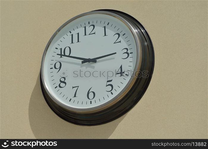 classic vintage wall clock on yellow background