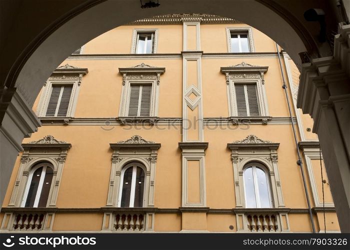 Classic windows on a newly restored building in Bologna, Italy