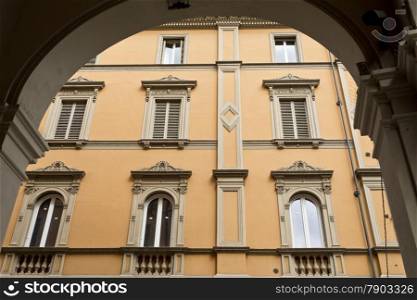 Classic windows on a newly restored building in Bologna, Italy