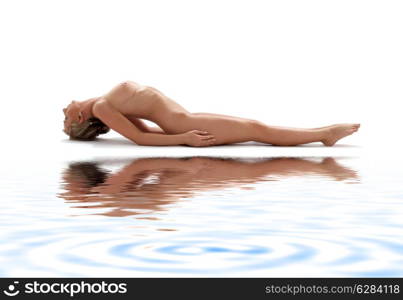 classical artistic nudity style picture of woman working out on white sand