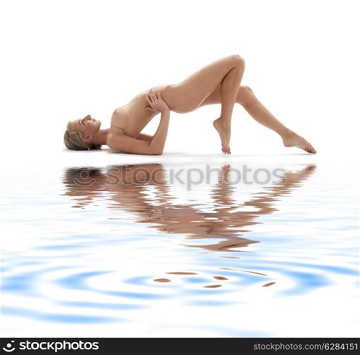 classical artistic nudity style picture of woman working out on white sand