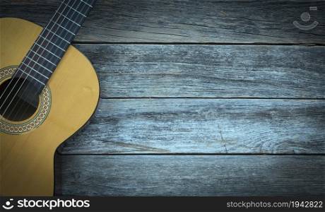Classical guitar on a wooden background