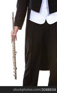 Classical music study concept. Male flutist musician performer with flute. Young elegant man wearing tailcoat holds instrument, part of body. Male flutist wearing tailcoat holds flute