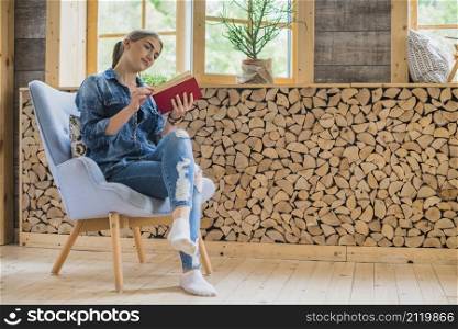 classy young woman looking book
