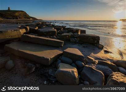 Clavell Tower at Kimmeridge Bay, at sunset, in Dorset