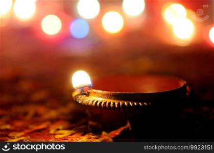 Clay diya l&s lit during Diwali Celebration. Greetings Card Design Indian Hindu Light Festival called Diwali