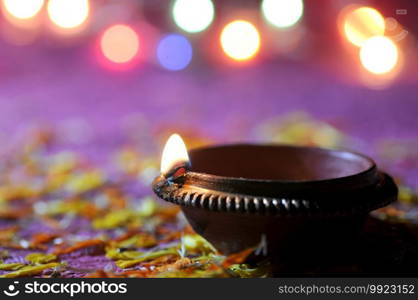 Clay diya l&s lit during Diwali Celebration. Greetings Card Design Indian Hindu Light Festival called Diwali