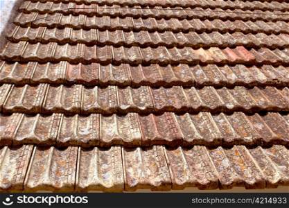 Clay flat roof tiles weathered in Ibiza Spain