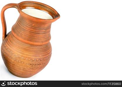 Clay jug with fresh milk isolated on white background. Healthy food. Free space for text.