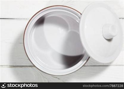 Clay pot on a white wooden table