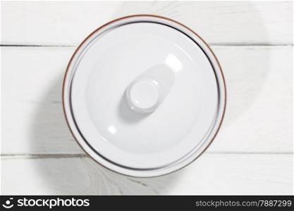 Clay pot on a white wooden table