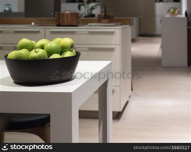 Clean and Modern Table in Stylish Kitch with Bowl of Apples