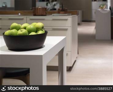 Clean and Modern Table in Stylish Kitch with Bowl of Apples