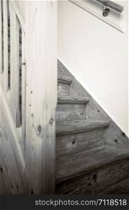 Clean and new wooden staircase in modern home interior close-up black and white. Clean and new wooden staircase in modern home interior close-up