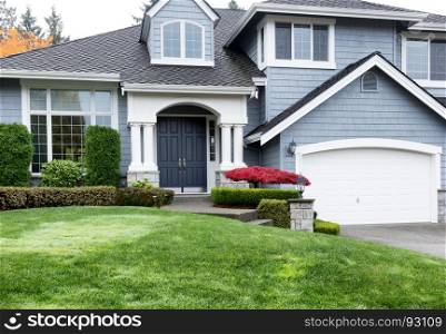 Clean home exterior during Autumn season with well maintain front yard