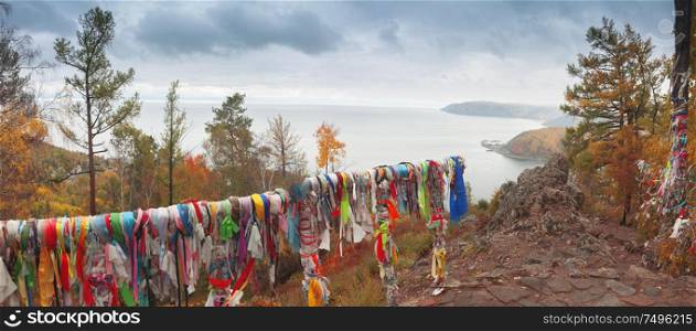 Clean lake Baikal and colorful traditional ribbons