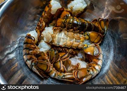 clean raw lobster tails prepared for grilling