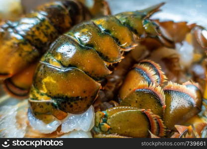 clean raw lobster tails prepared for grilling