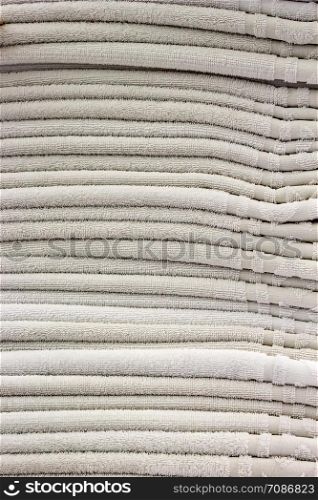Clean towels. Many clean white towels are neatly stacked on.