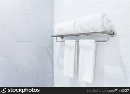 clean towels with hanger on wall bathroom interior background.