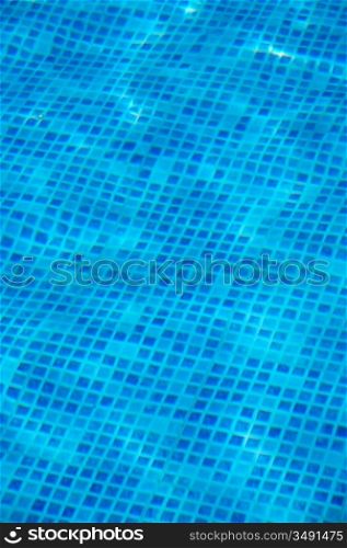 Clean water in a blue swimming pool