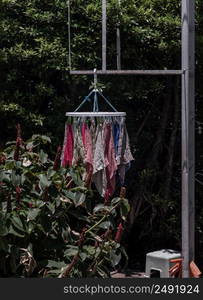 Cleaned cotton hand towels after using. Kitchen hand cloths or Washcloth for dishes hanging in the sunlight after washing, House cleaning concept background, Selective focus.