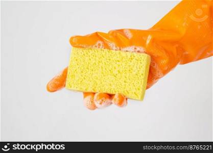 Cleaner concept, Hand in orange rubber gloves and holding yellow sponge with foam for cleaning.