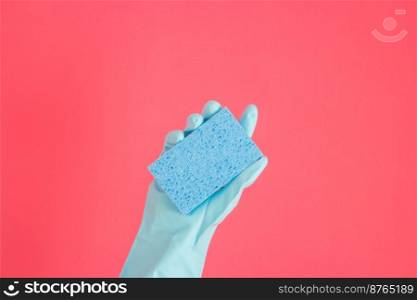 Cleaner concept, Hand in rubber gloves and holding light blue sponge for cleaning in home.