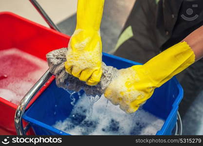 Cleaning concept photo. Cleaning concept. Closeup photo of woman cleaning shopping center