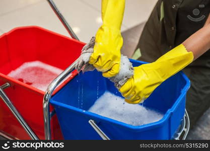 Cleaning concept photo. Cleaning concept. Closeup photo of woman cleaning shopping center