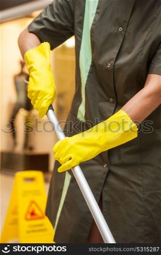 Cleaning concept photo. Cleaning concept. Closeup photo of woman cleaning shopping mall