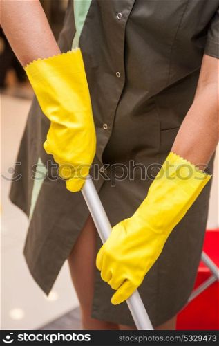Cleaning concept photo. Cleaning concept. Closeup photo of woman cleaning shopping mall