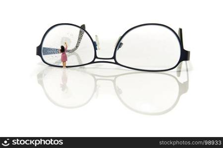 cleaning glasses by little world miniature woman figure. cleaning glasses by little woman figure