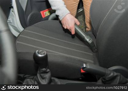 cleaning of the interior of the car with a vacuum
