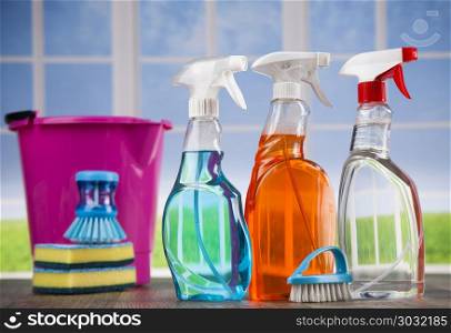 Cleaning supplies and window background. Group of assorted cleaning and window background