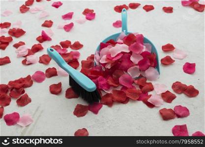 cleaning the floor from imitation red rose petals as end of marriage proposal