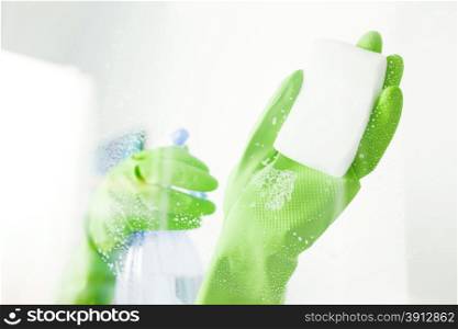 Cleaning window pane with detergent, cleaning concept