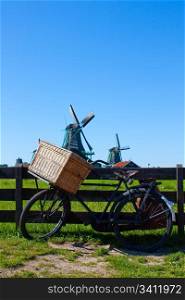 Clear and traditional landmark for Holland: bicycle and mills