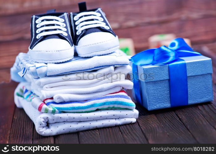 Clear baby clothes on the wooden table