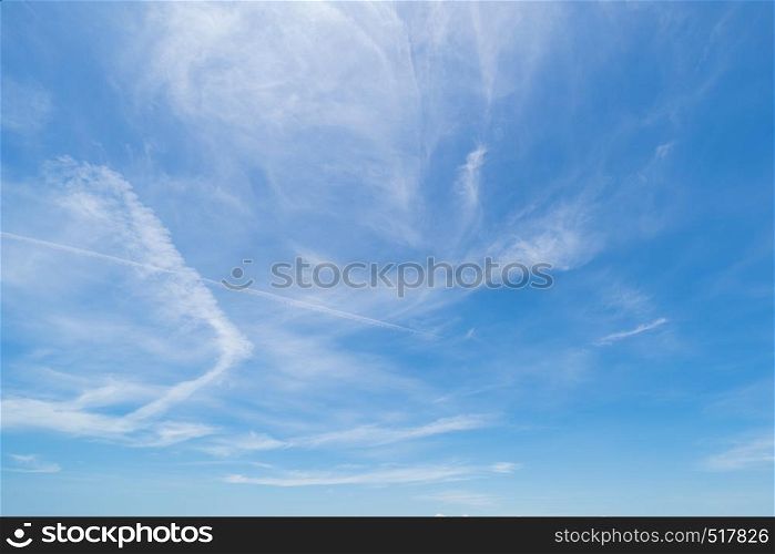 Clear blue sky with white fluffy clouds. Nature background