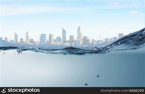 Clear blue waters. Underwater image of clear waters and city landscape