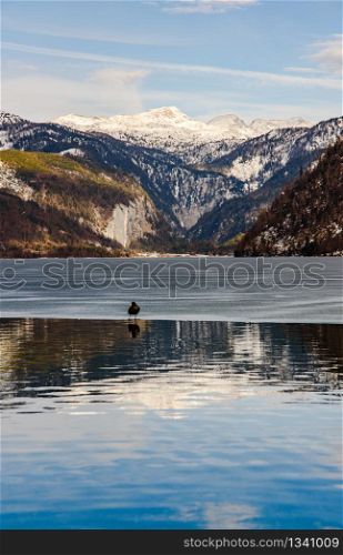 Clear Cold Landscape with blue sky at Grundlsee, Austria, winter, frozen lake. Tourist destination.. Clear Cold Landscape with blue sky at Grundlsee, Austria, winter, frozen lake. Travel spot