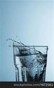 clear glass with water splashing. High resolution photo. clear glass with water splashing. High quality photo