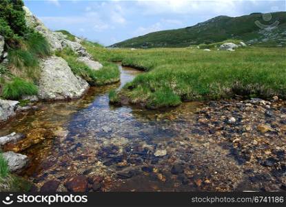 Clear high mountain spring waters in summer
