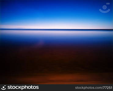 Clear morning at smooth mountain lake abstraction