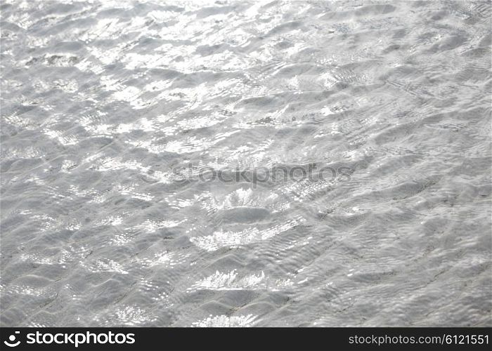 Clear sea water over sand on tropical beach, background