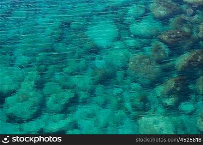 Clear sea water with pebbles